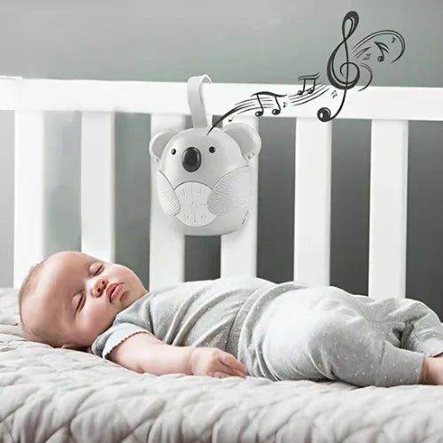 Bébé endormi avec veilleuse musicale diffusant une lumière douce et des sons apaisants